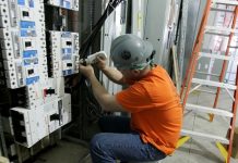 man working with switchboard