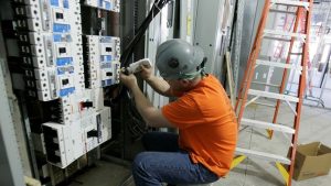 man working with switchboard