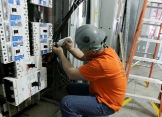 man working with switchboard