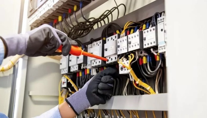 person repairing the switchboard 